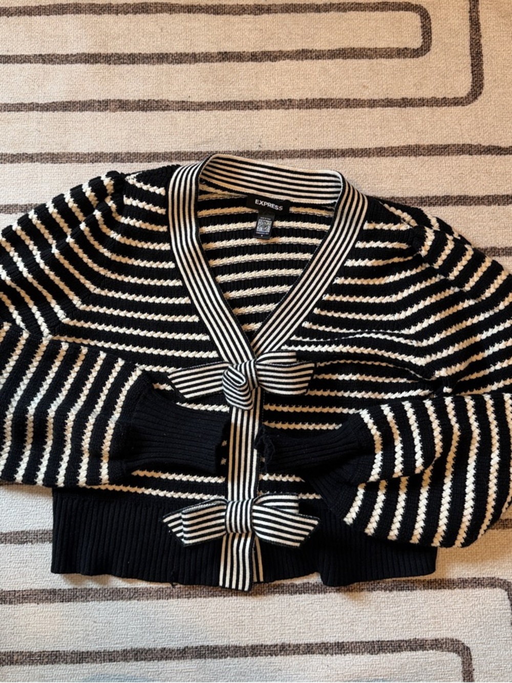 Express Black and Cream Striped Tie-Front Cardigan with bow clasps